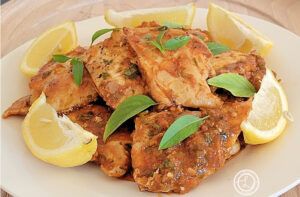 Fusion Moroccan Chicken on a plate with lemon slices