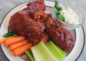Coated chicken wing with carrots, celery, ad ranch dip.