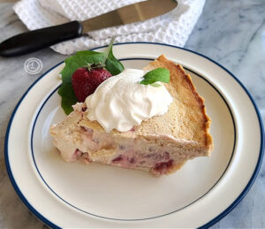 Strawberry Rhubarb Custard slice of pie on a white plate