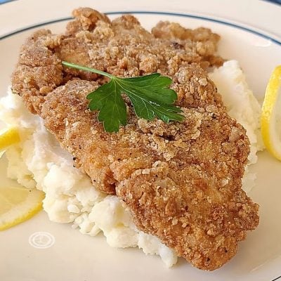 Chicken Fried Chicken on a bed of potatoes