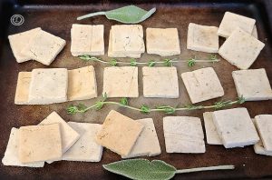 Crackers with sage & thyme on a baking stone.
