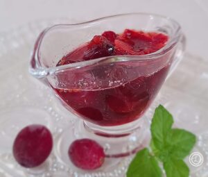 A small syrup container of cranberry Syrup