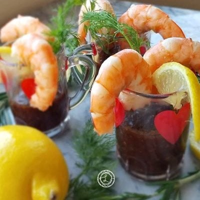 Smoky BBQ Cocktail Sauce in Swedish Heart Cocktail Glasses with dill, lemon and shrimp
