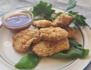Fingers on a plate with BBQ sauce