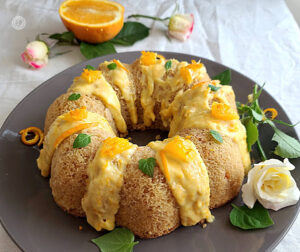 Gluten-Free Orange Marmalade Cake on a plate with Orange Glaze