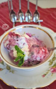 A coffee cup with Huckleberry Cheesecake Ice Cream