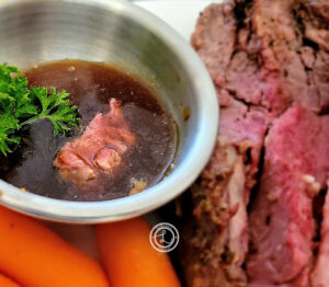 Keto Prime Rib Au Jus with prime rib in the background