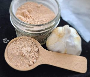 Rub in a jar and on a spoon with a bulb of garlic to decorate.