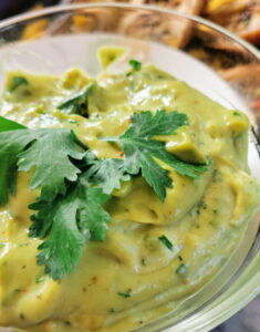 Guacamole Ranch Dipping Sauce with a piece of cilantro