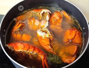 Seafood Broth lobster shells in a pot