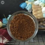 Homemade Coconut Brown Sugar. A close up of a bowl of sugar with a basket in the background.