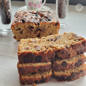 Gluten-Free Espresso Chocolate Banana Bread pictured is slices laying in front of the loaf.