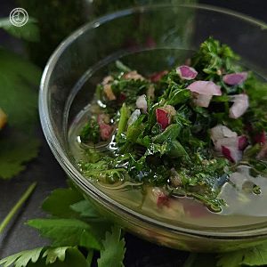 A close up of Avocado Oil Chimichurri Sauce in a bowl.