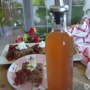 Refined Sugar-Free Syrup in a bottle in front of pancake bars.