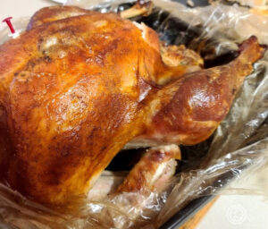 Dry Brined Roasted Turkey cut out of an oven bag and cooling.