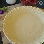 Gluten-Free Pie Crust Recipe Gluten-Free Pie Crust unfilled on a cutting board.