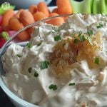 Dairy-Free French Onion Dip in a bowl with fresh veggies in the background. 