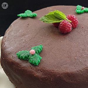 A photo of half a cake iced with marzipan