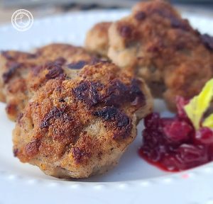 Ground Turkey Breakfast Sausage on a plate with some lingonberries