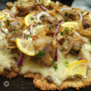 A close-up of Chicken Marsala Pizza