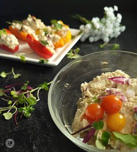 Horseradish Tuna Salad in a bowl with some in baby bell peppers in the background.