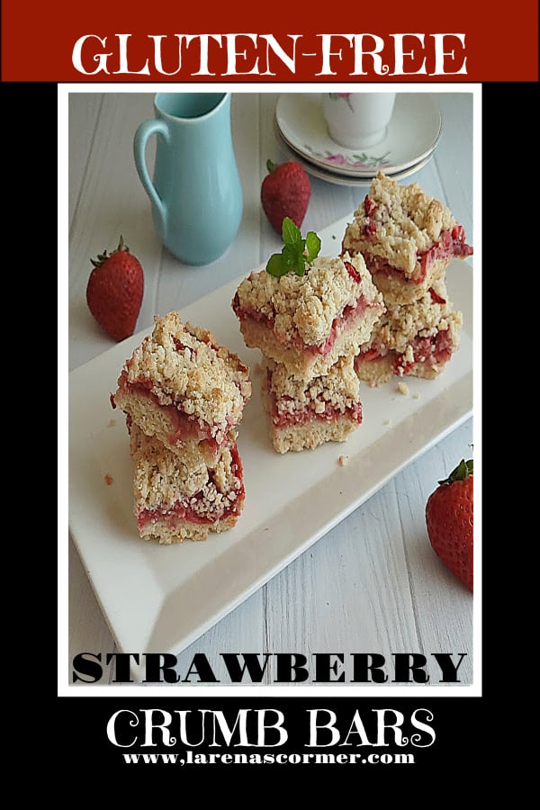 Gluten-Free Strawberry Bars Recipe Gluten-Free Strawberry Crumb Bars on a platter with espresso cups and a small creamer pitcher in the background.