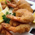 Gluten-Free Coconut Shrimp Recipe Gluten-Free Coconut Shrimp a close up of shrimp on a platter.