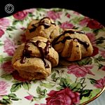 Gluten-Free Chocolate Fillied Pastries on a plate and glazed with chocolate.