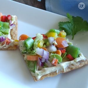 A close up of a slice of Gluten-Free Asian Veggie Pizza and a sliver of another slice.
