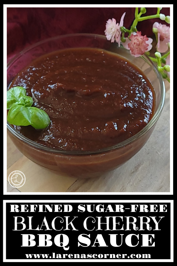 Black Cherry BBQ Sauce Recipe Black Cherry BBQ Sauce in a bowl with a sprig of basil.