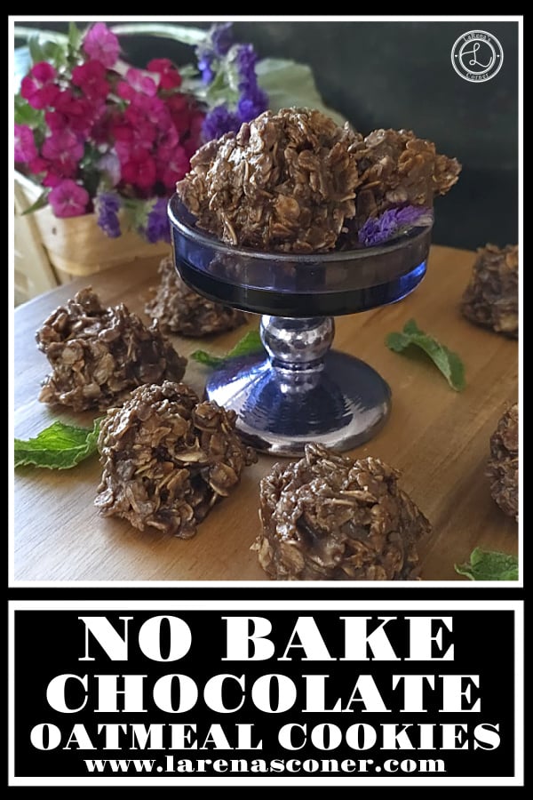 No Bake Chocolate Oatmeal. Cookies on a cupcake stand with more around it, flowers in a basket behind the cookies.