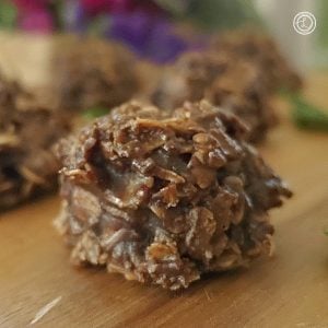 No Bake Chocolate Oatmeal Cookies on a cutting board. Close up of one of the cookies.