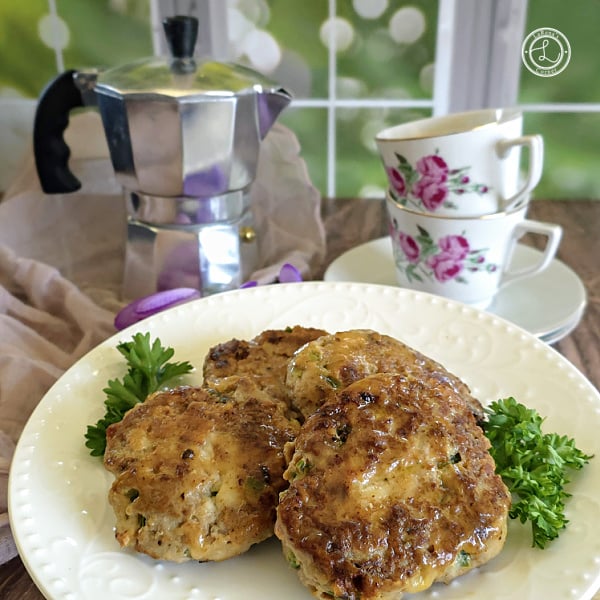 Ground Turkey Cheddar Jalapeno Sausage Recipe Ground Turkey Cheddar Jalapeno Sausage. Sausages on a plate with some parsley in front of a mini espresso maker with cups and saucers.