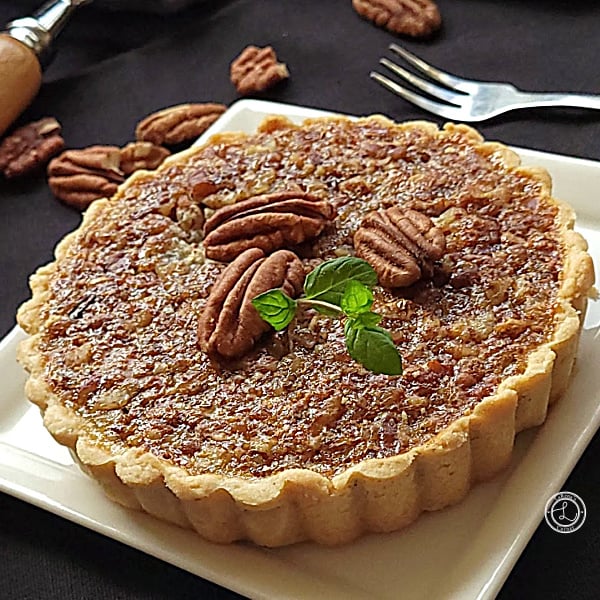Refined Sugar-Free Maple Pecan Filling Recipe Refined Sugar-Free Maple Pecan Filling in a tart shell on a plate. Pecans and a fork in the background.